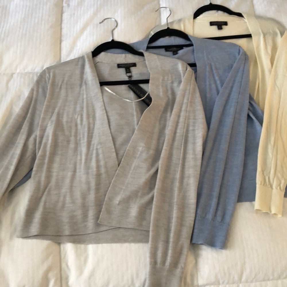 Set of three cardigans.